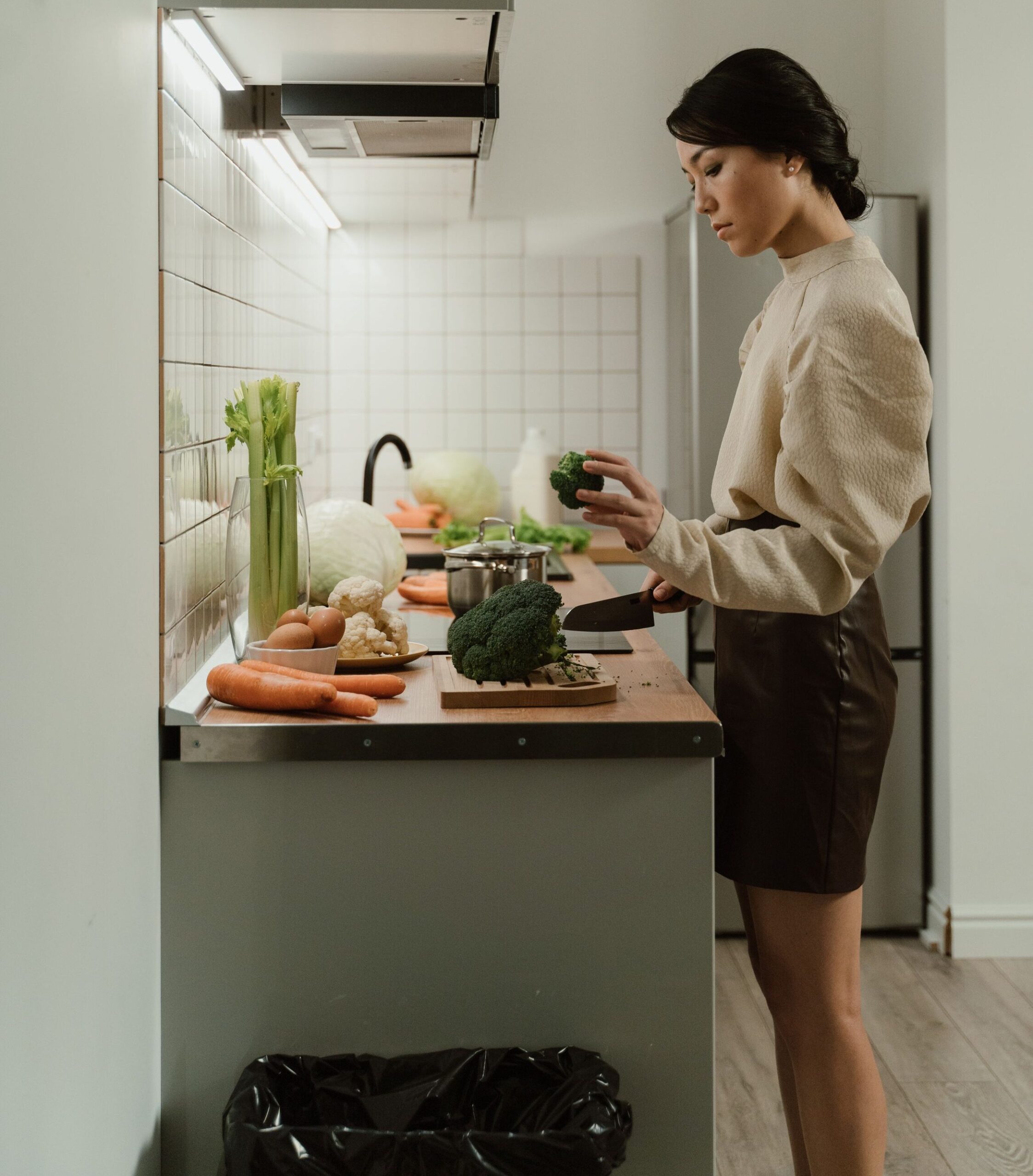 Woman preparing healthy food in a modern kitchen